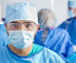 stock-photo-20155731-serious-surgeon-in-a-hospital-surgery-center